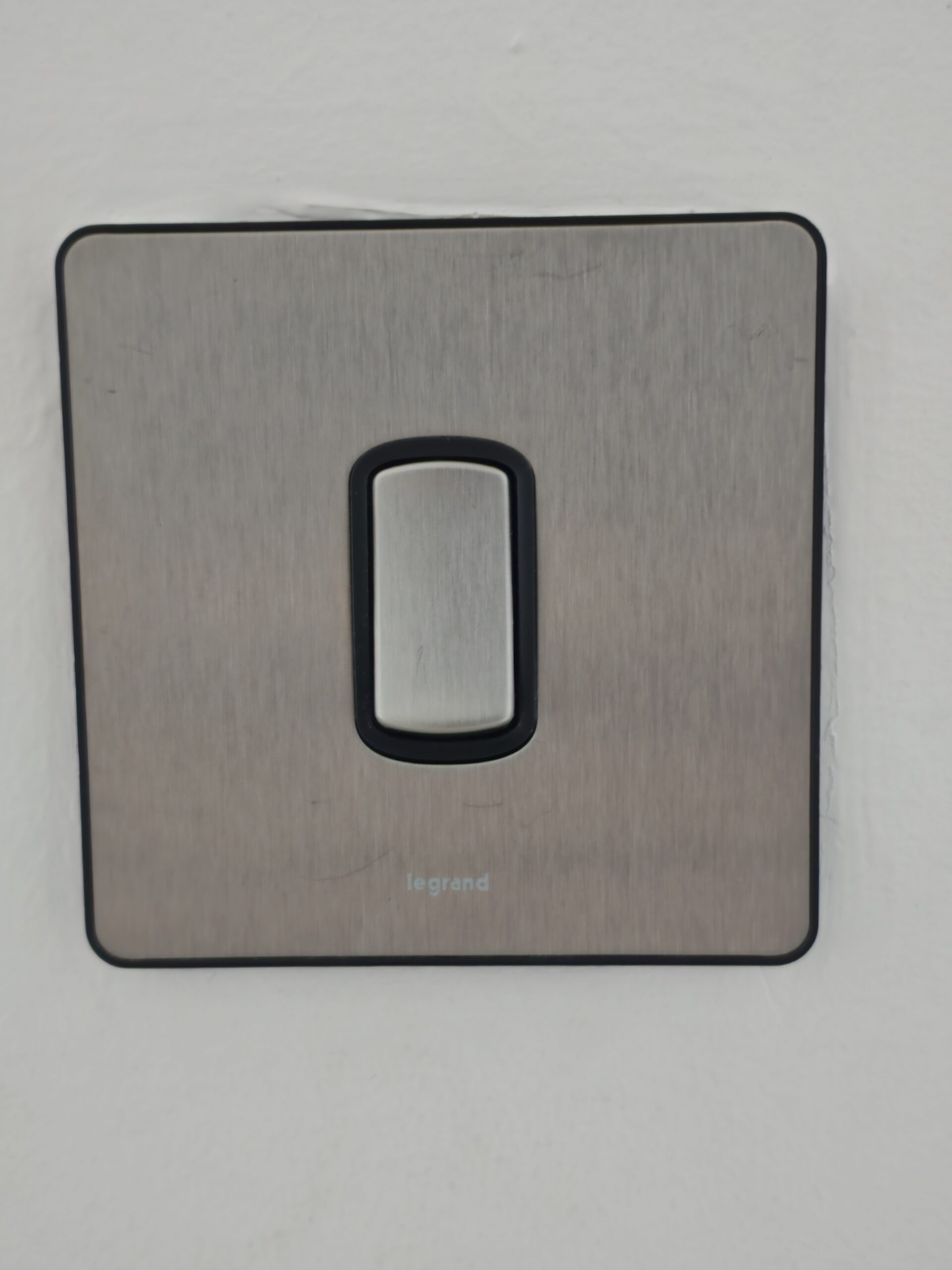 Light switch area after cleaning — hand grease removed with Multipurpose Cleaner and Antiseptic Disinfectant Dubai UAE
